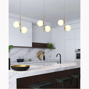 Althar - 3/2 Light White Glass Ball Pendant Light in White Glass and Gold Brass